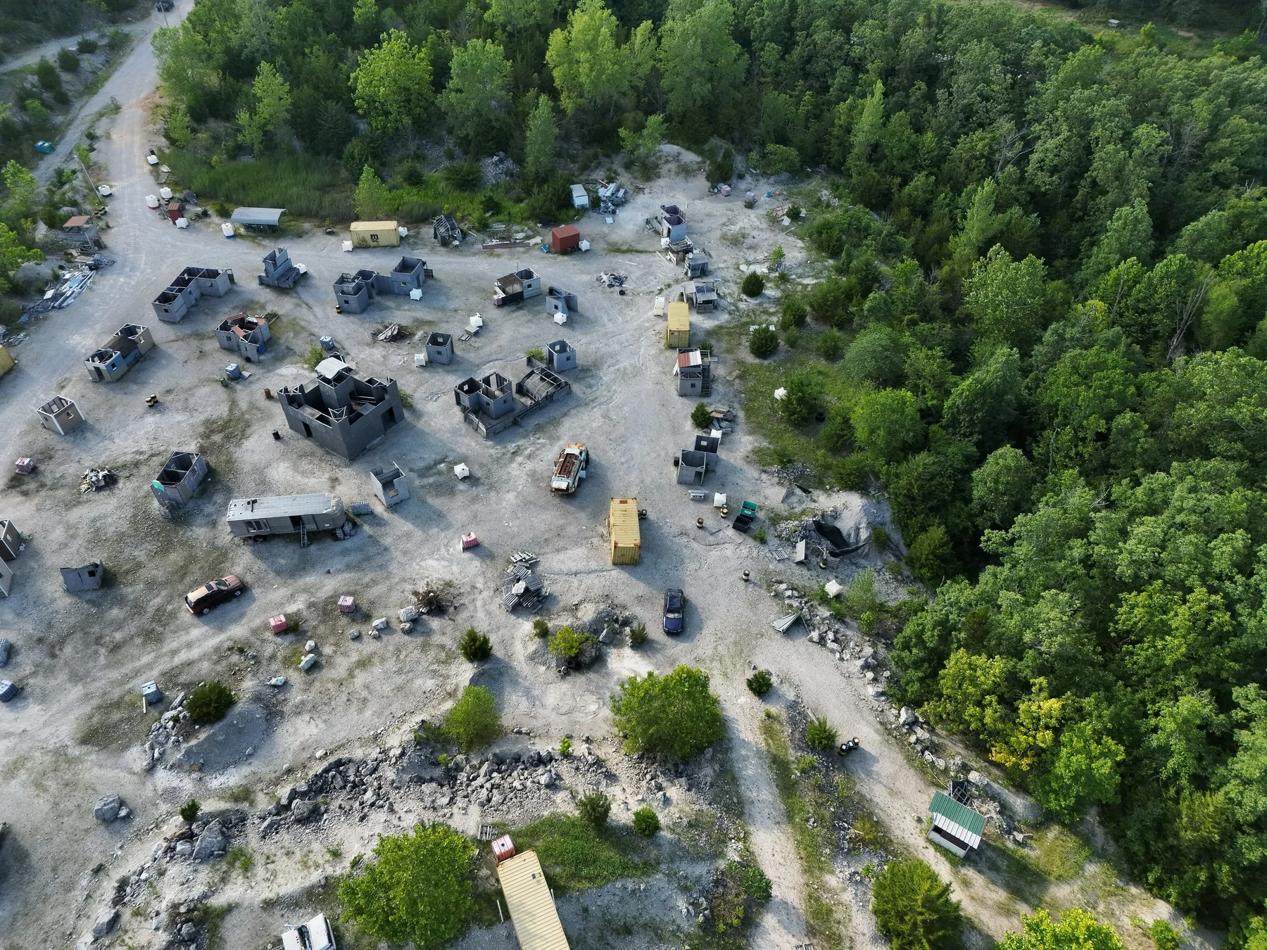 Oblique aerial view of The Rock Airsoft staging area and field structures in Bolivar, Missouri.