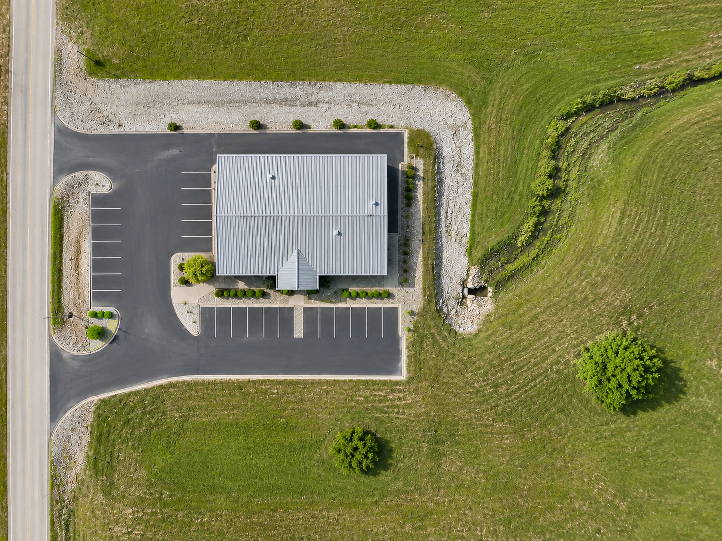 Orthomosaic-style planning map of a Missouri commercial property with building, parking, access, and drainage context.
