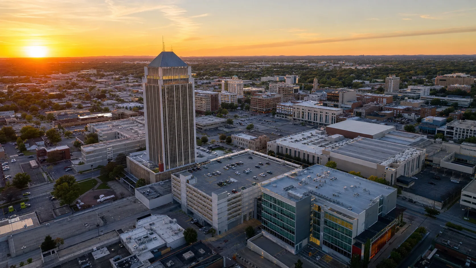 Illustrative aerial view of downtown Springfield, Missouri commercial buildings at golden hour.